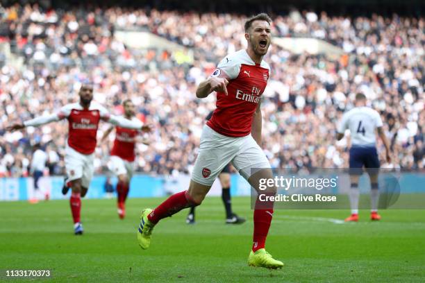 Aaron Ramsey of Arsenal celebrates after scoring his team's first goal during the Premier League match between Tottenham Hotspur and Arsenal FC at...