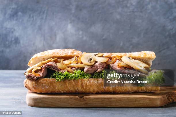 beef baguette sandwich - sandwich baguette stock pictures, royalty-free photos & images