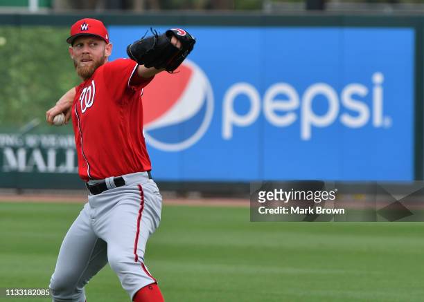 Stephen Strasburg of the Washington Nationals warms up before the spring training game against the Miami Marlins at Roger Dean Stadium on March 1,...
