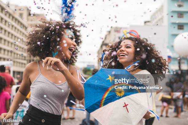 friends dancing carnival - fiesta stock pictures, royalty-free photos & images