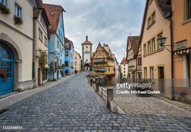 famous intersection with stunning medieval buildings in rothenburg germany - village stock-fotos und bilder