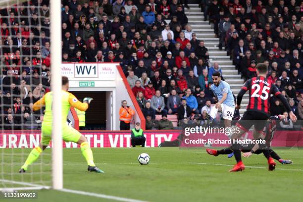 Riyad Mahrez of Manchester City scores his team's first goal past Artur Boruc of AFC Bournemouth during the Premier League match between AFC...