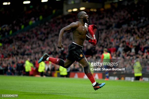 Romelu Lukaku of Manchester United celebrates after scoring his team's third goal during the Premier League match between Manchester United and...