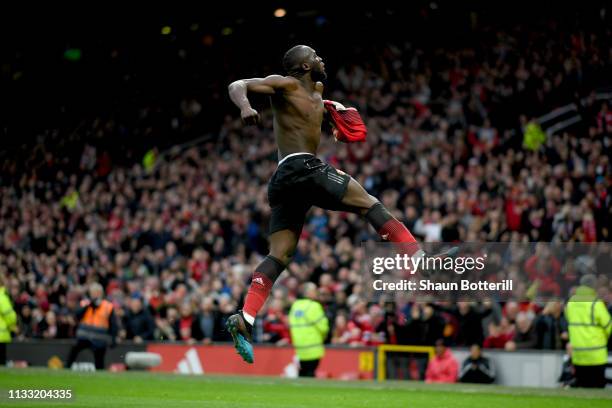 Romelu Lukaku of Manchester United celebrates after scoring his team's third goal during the Premier League match between Manchester United and...