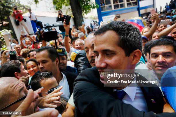 Venezuelan opposition leader Juan Guaidó, recognized by many members of the international community as the country's rightful interim ruler, greets...