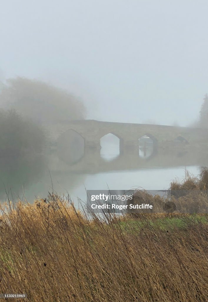 Ancient Stone Bridge in Mist