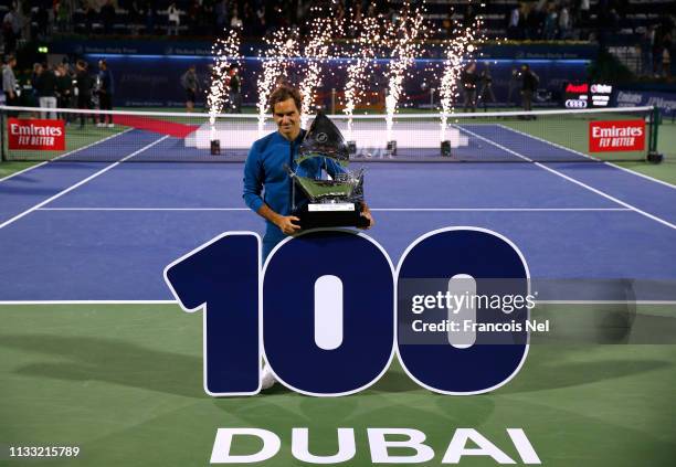 Roger Federer of Switzerland poses with the winners trophy after victory during day fourteen of the Dubai Duty Free Championships at Tennis Stadium...