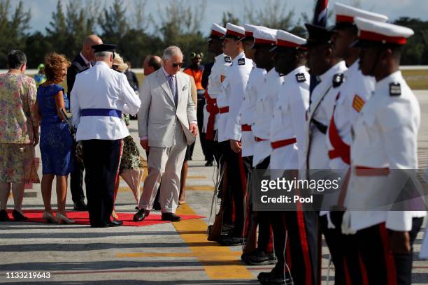 Prince Charles, Prince of Wales and Camilla, Duchess of Cornwall arrive at the Owen Roberts International Airports on March 27, 2019 in George Town,...