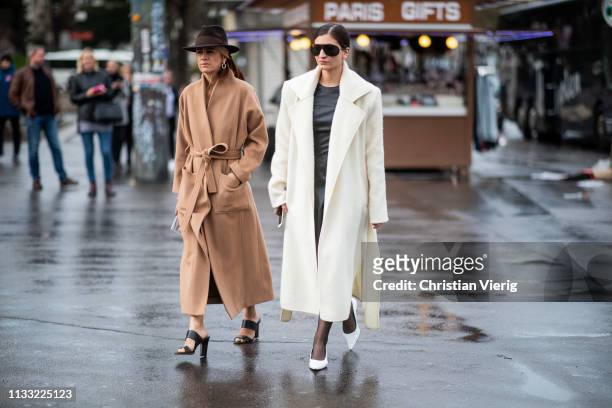 Celine Aagaard is seen wearinng belted beige coat, hat and Katarina Petrovic wearing coat outside Haider Ackermann during Paris Fashion Week...