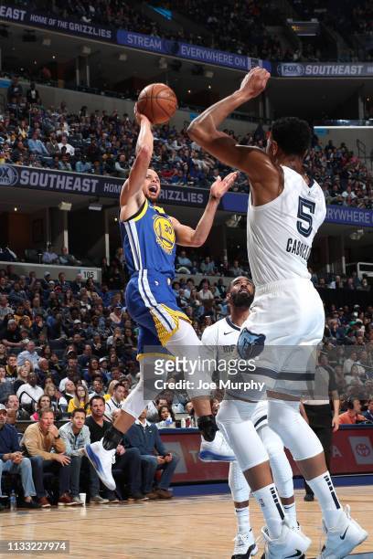 Stephen Curry of the Golden State Warriors shoots off balance floater against the Memphis Grizzlies on March 27, 2019 at FedExForum in Memphis,...