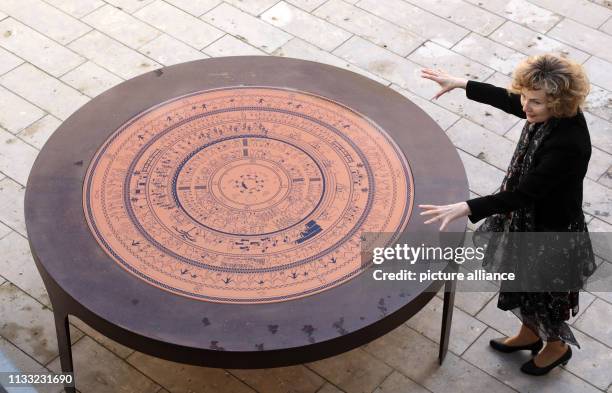 March 2019, Mecklenburg-Western Pomerania, Penzlin: Andrea Rudolph, director, shows the "Shield of Achilles", which shows the Greek world view, in...