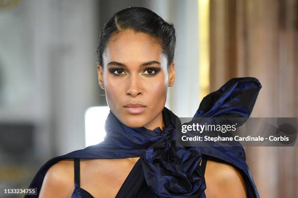 Model Cindy Bruna walks the runway during the Elie Saab show as part of the Paris Fashion Week Womenswear Fall/Winter 2019/2020 on March 02, 2019 in...