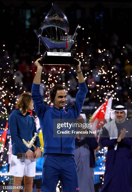 Roger Federer of Switzerland poses with the winners trophy after victory during day fourteen of the Dubai Duty Free Championships at Tennis Stadium...