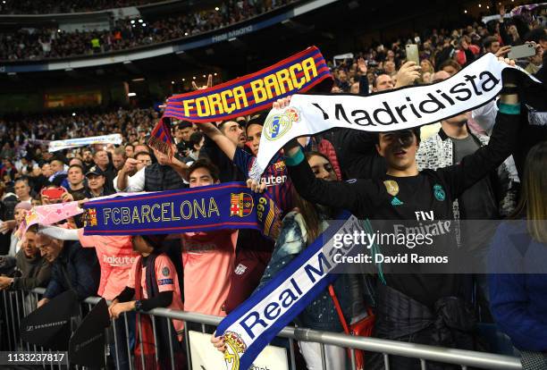 Fans show their support during the La Liga match between Real Madrid CF and FC Barcelona at Estadio Santiago Bernabeu on March 02, 2019 in Madrid,...