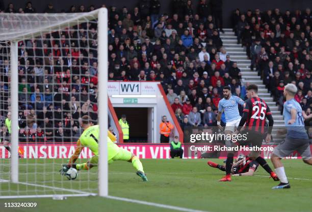 Riyad Mahrez of Manchester City scores his team's first goal past Artur Boruc of AFC Bournemouth during the Premier League match between AFC...