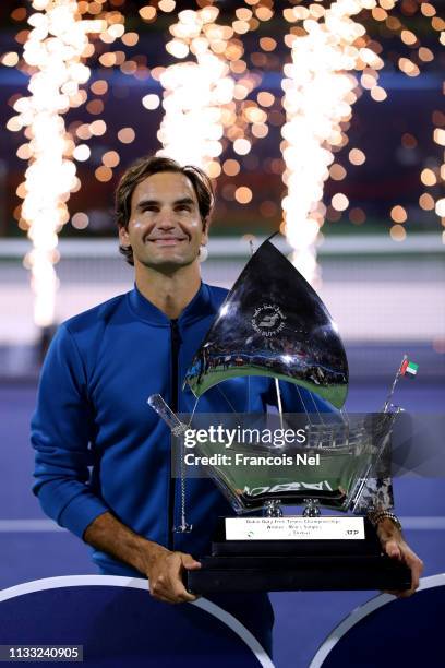 Roger Federer of Switzerland poses with the winners trophy after victory during day fourteen of the Dubai Duty Free Championships at Tennis Stadium...