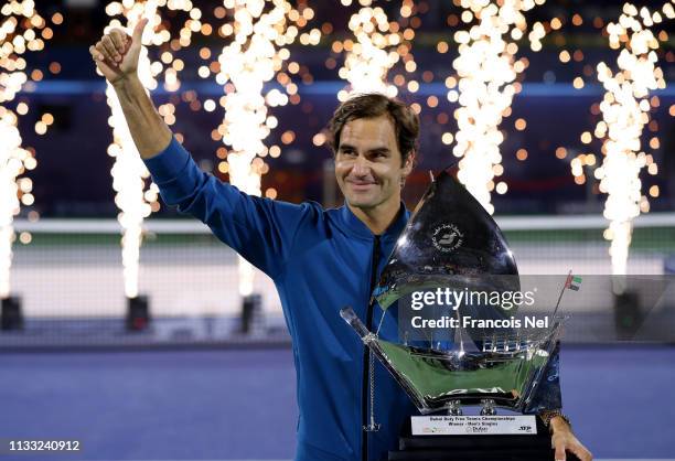 Roger Federer of Switzerland poses with the winners trophy after victory during day fourteen of the Dubai Duty Free Championships at Tennis Stadium...