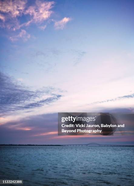 vertical blue morning over robert moses bridge on long island - robert moses bridge stockfoto's en -beelden