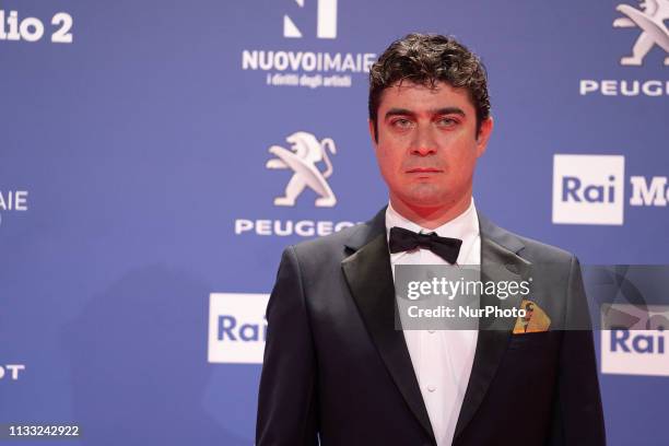 Riccardo Scamarcio walks a red carpet ahead of the 64. David Di Donatello awards ceremony - Red Carpet on March 27, 2019 in Rome, Italy.