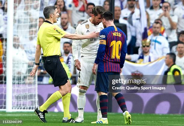 Lionel Messi of Barcelona and Sergio Ramos of Real Madrid argue during the La Liga match between Real Madrid CF and FC Barcelona at Estadio Santiago...