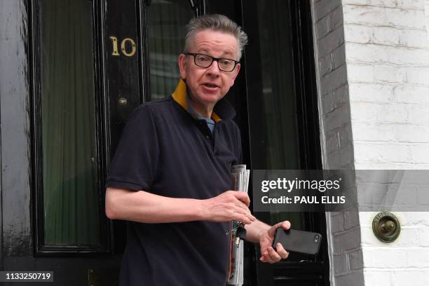 Britain's Environment, Food and Rural Affairs Secretary Michael Gove leaves his residence to go for a run in west London on March 28, 2019.