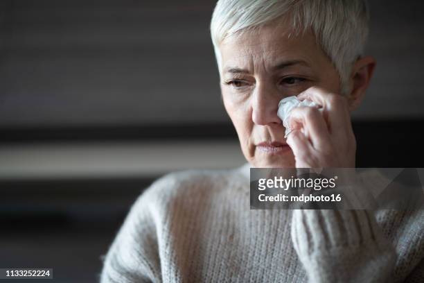 upset woman - widow pension stock pictures, royalty-free photos & images