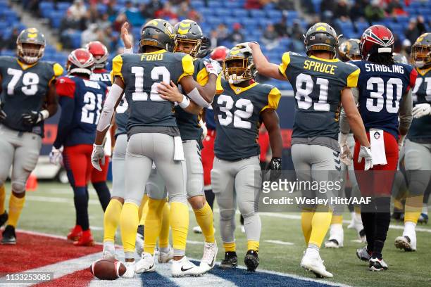 Dontez Ford of San Diego Fleet is congratulated by his teammates after scoring a first quarter touchdown reception against the Memphis Express in the...