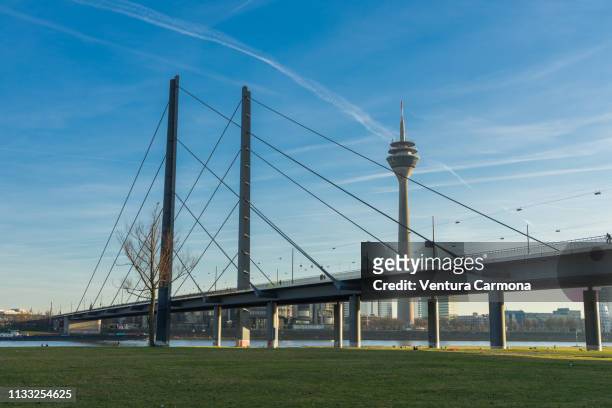 rhine river bank in düsseldorf, germany - stadtsilhouette stock pictures, royalty-free photos & images