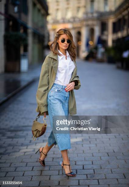 Gitta Banko is seen wearing a white blouse with puffy sleeves and flounces by Balossa, khaki-colored utility style parka by glab, bleach slime wide...