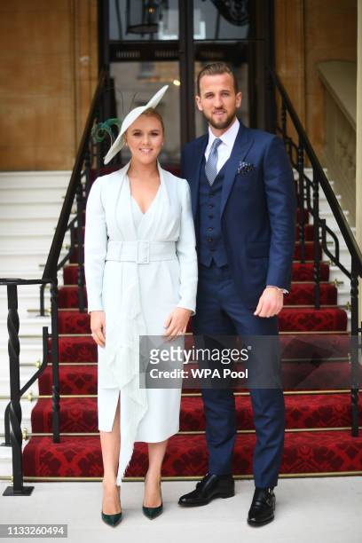 England football captain and Tottenham Hotspur player Harry Kane with his partner Kate Goodland arrive for his investiture ceremony at Buckingham...
