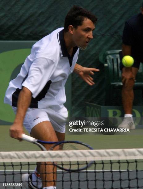 Costarican tennis player Juan Antonio Marin tries to hit the ball 09 February 2001 during a Davis Cup American Zone selection match in Escazu, Costa...