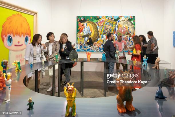 Visitors take photos of art at Art Basel on March 28, 2019 in Hong Kong, Hong Kong.