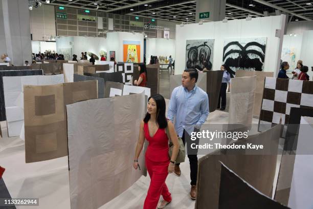Visitors walk through an art installation at Art Basel on March 28, 2019 in Hong Kong, Hong Kong.