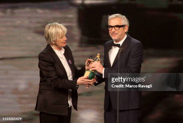 Mexican film director Alfonso Cuaron receives his award for best foreign film on the occasion of the 64th edition of the David di Donatello Awards in...