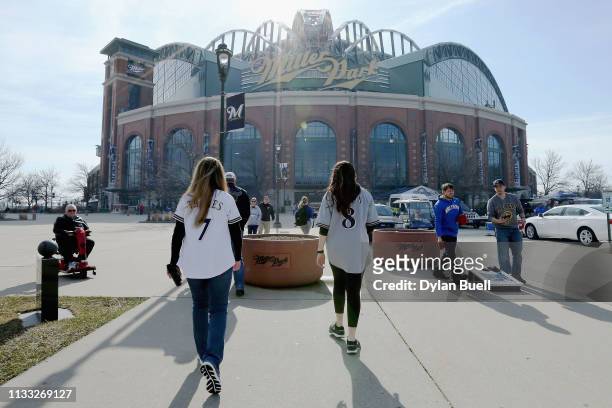 Fans walk to the field before the game between the St. Louis Cardinals and Milwaukee Brewers during Opening Day at Miller Park on March 28, 2019 in...