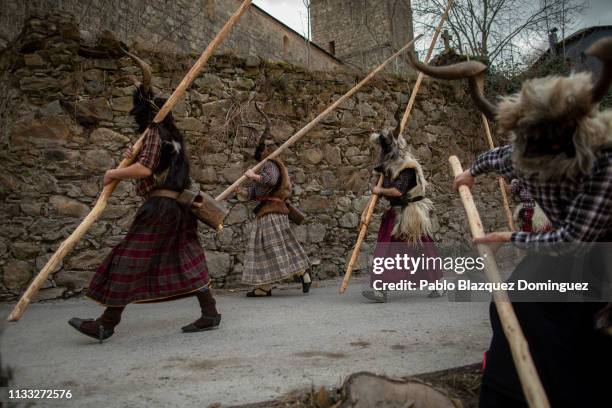 Men carrying billy goats’ horns and goat skins known as ‘Trangas’ take part in Bielsa traditional carnival on March 02, 2019 in Bielsa, Huesca...