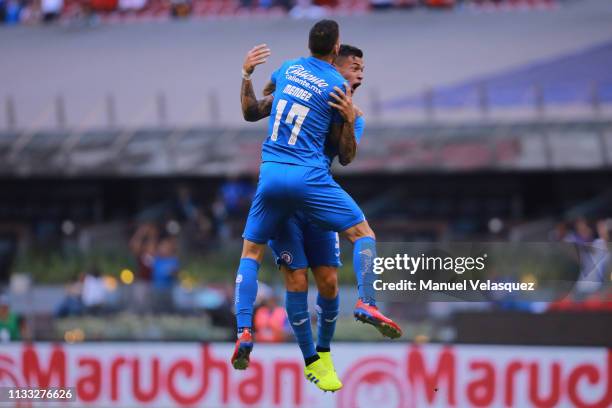 Milton Caraglio of Cruz Azul celebrates with teammate Edgar Mendez after scoring the equalizer during the 9th round match between Cruz Azul and...