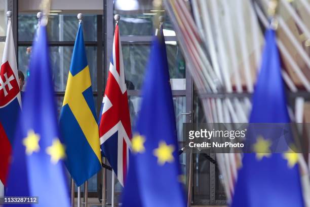 Flags and flags of the European countries state member next to the red carpet where EU leaders arrive in the EU in the European Council building...