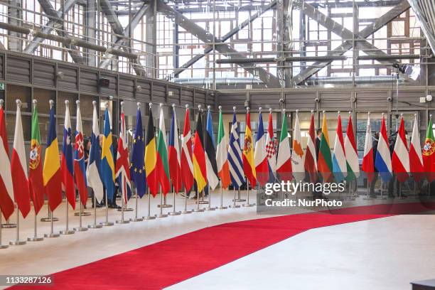 Flags and flags of the European countries state member next to the red carpet where EU leaders arrive in the EU in the European Council building...