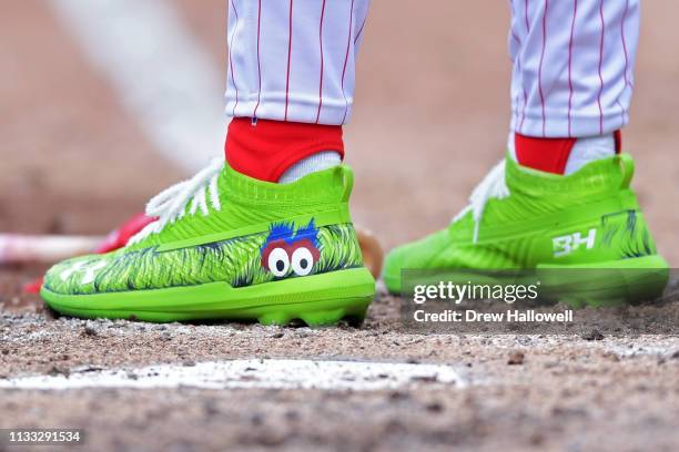 Bryce Harper of the Philadelphia Phillies wears cleats with the Philly Phanatic cleats during the game against the Atlanta Braves on Opening Day at...