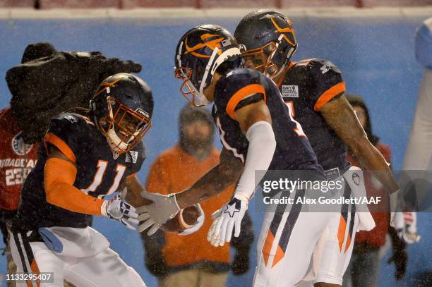 Donteea Dye Jr. #11 of Orlando Apollos celebrates a touchdown against the Salt Lake Stallions with Rannell Hall and Jalin Marshall during their...