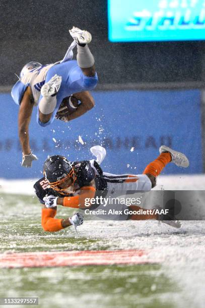 Bryce Canady of Orlando Apollos tackles Joel Bouagnon of Salt Lake Stallions during their Alliance of American Football game at Rice Eccles Stadium...