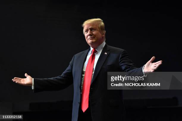 President Donald Trump arrives for a campaign rally in Grand Rapids, Michigan on March 28, 2019.
