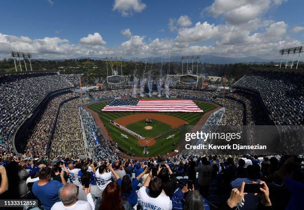 Fans cheer for an Opening Day baseball game between Arizona Diamondbacks and Los Angeles Dodgers at Dodger Stadium on March 28, 2019 in Los Angeles,...