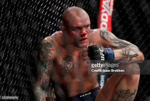 Anthony Smith collects himself after taking a knee to the face during a light heavyweight title bout against Jon Jones during UFC 235 at T-Mobile...