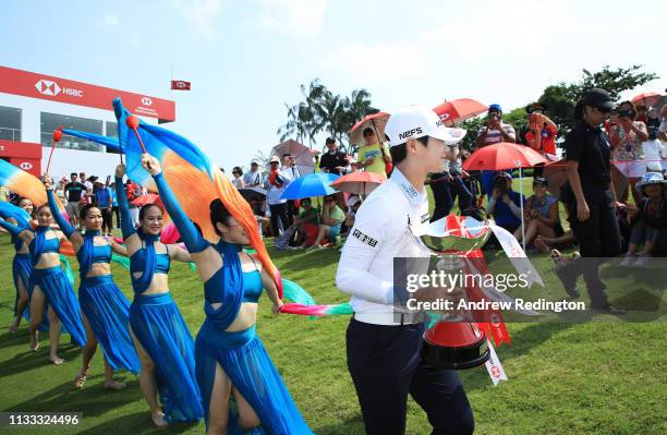 Sung Hyun Park of South Korea celebrates with the winner's trophy after the final round of the HSBC Women's World Championship at Sentosa Golf Club...