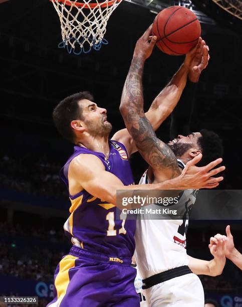 Kevin Lisch of the Kings and DJ Kennedy of Melbourne United compete for the ball during game two of the NBL Semi Final series between the Sydney...