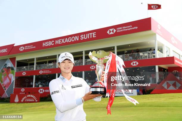 Sung Hyun Park of South Korea celebrates with the winner's trophy after the final round of the HSBC Women's World Championship at Sentosa Golf Club...
