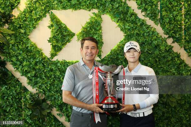 Sung Hyun Park of South Korea celebrates with Tony Cripps, CEO HSBC Singapore, and the winner's trophy after the final round of the HSBC Women's...