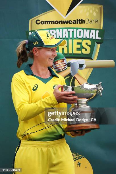 Meg Lanning of Australia is presented the winners trophy during game three of the One Day International Series between Australia and New Zealand at...